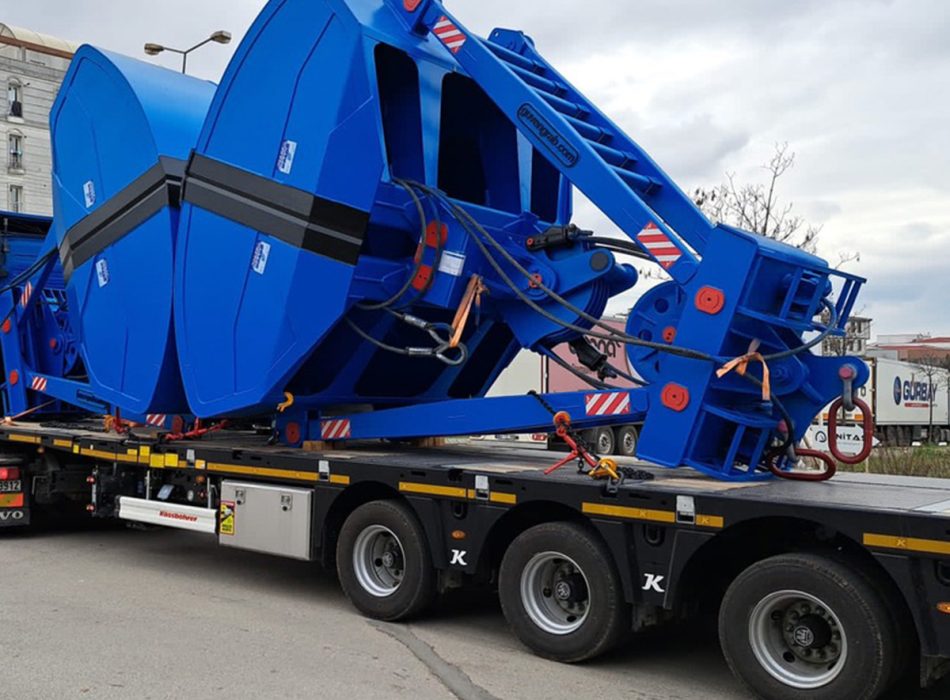 Oversized marine cargo equipment being transported on a flatbed truck.