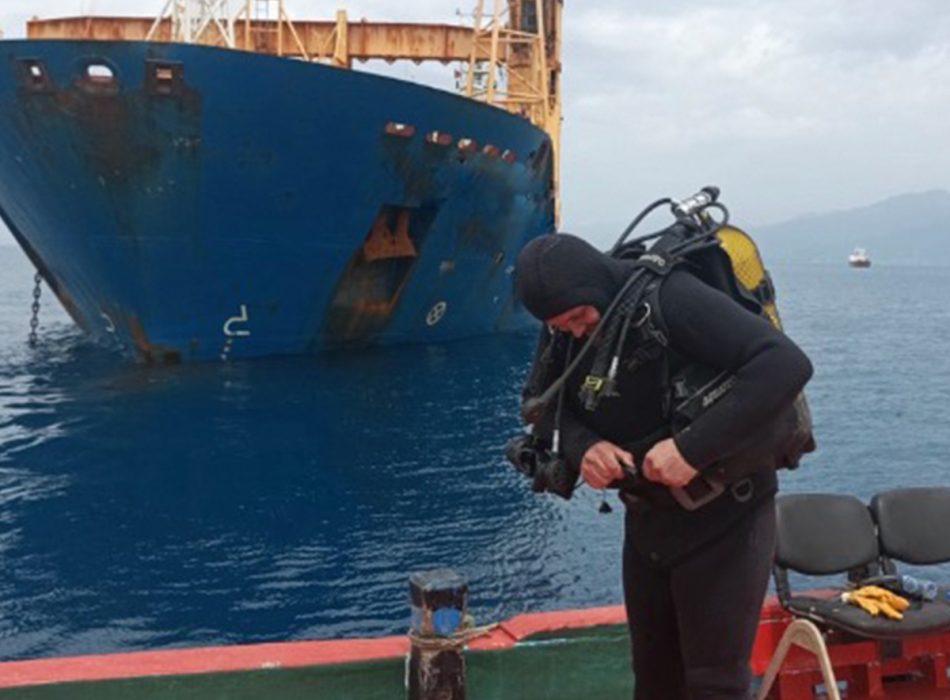 Diver ready for an underwater inspection with CCTV equipment.