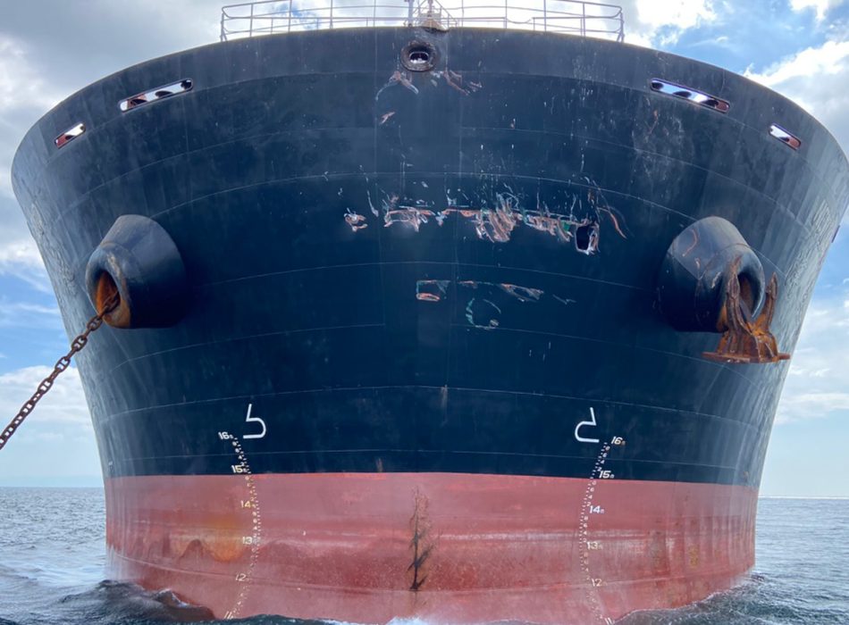 The bow of a large vessel undergoing urgent repair works.